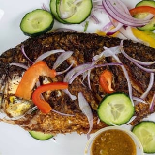 Fish (bone in whole fish) with rice and salad